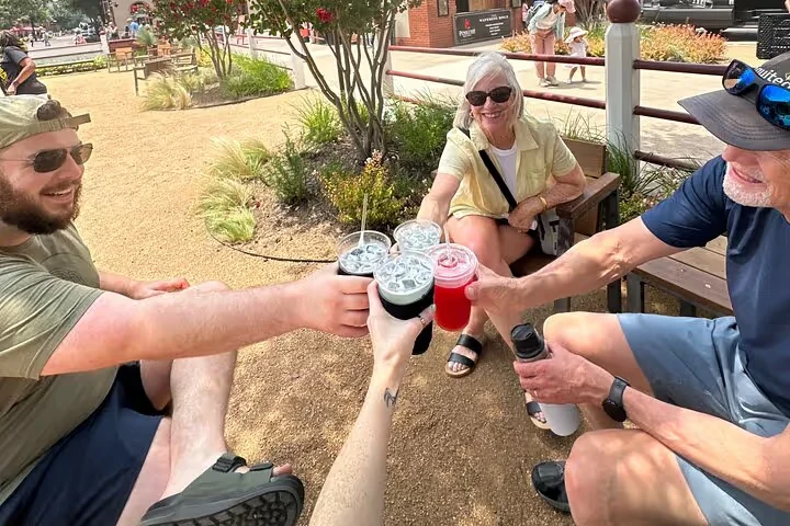 A group of friends cheersing their drinks together